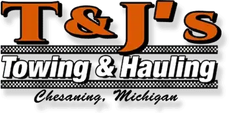 T&J’s Towing & Hauling logo with orange and black text, Chesaning, Michigan