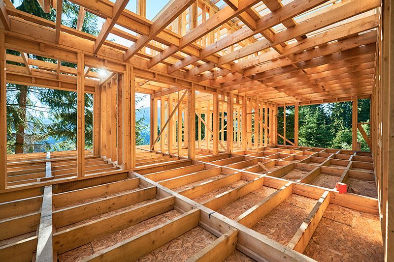 The inside of a wooden house under construction.