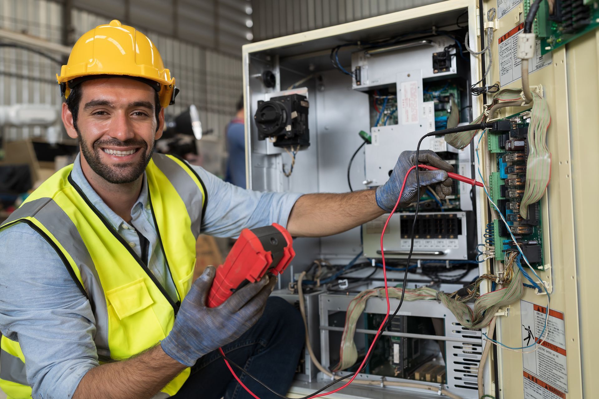 Electrician using electrical meters on an electric system.