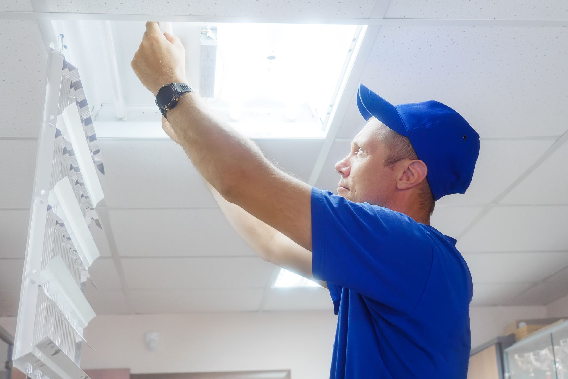 Electrical contractor servicing a distribution panel while performing system maintenance. Electrical contractor servicing a distribution panel while performing system maintenance.
