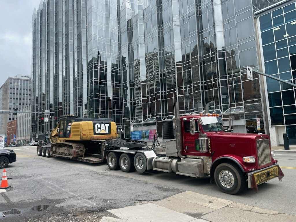 Schaaf Excavating Contractors Hauling Equipment to demolition job