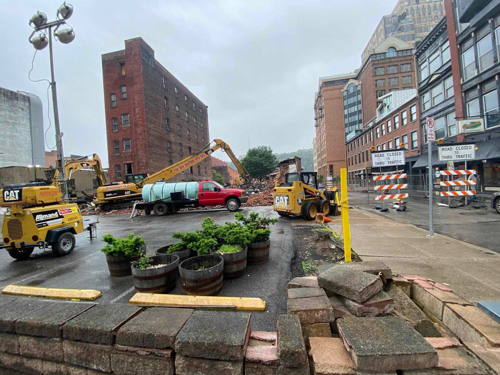 Equipment by Schaaf parked at the edges of demolition site.
