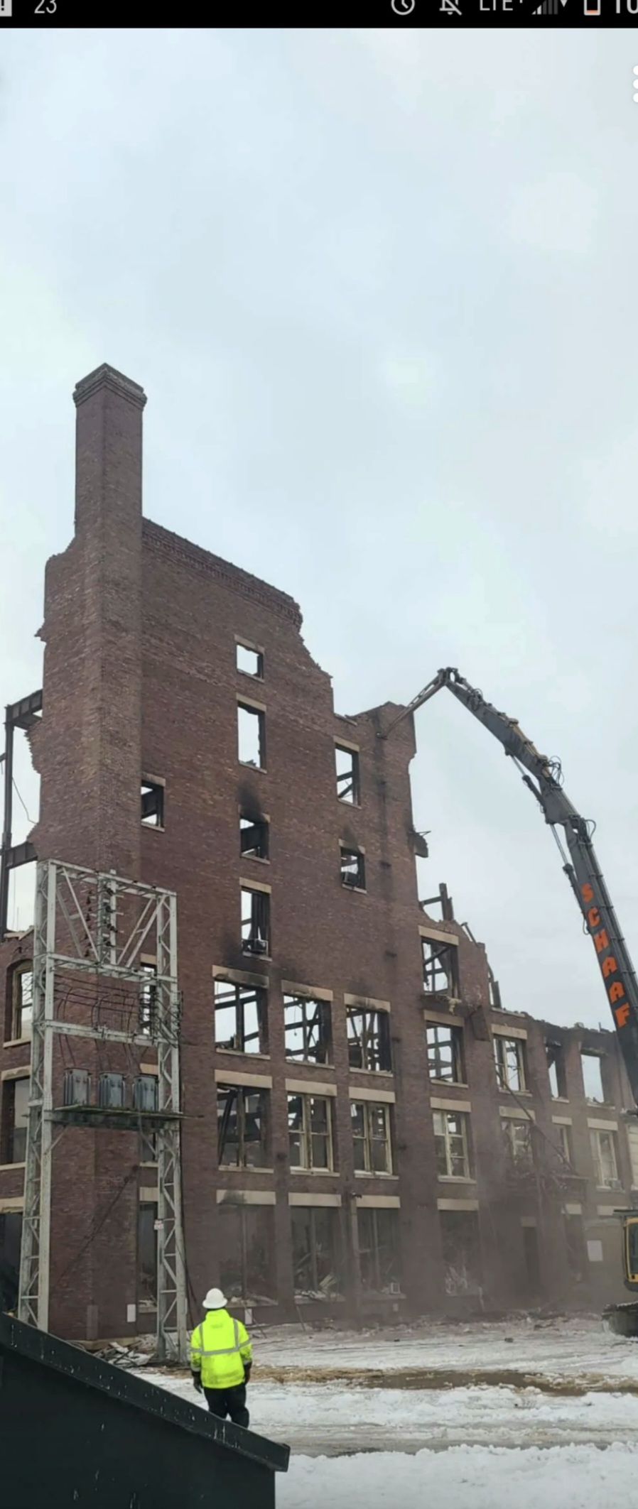 schaaf high reach excavator tearing down an old brick warehouse