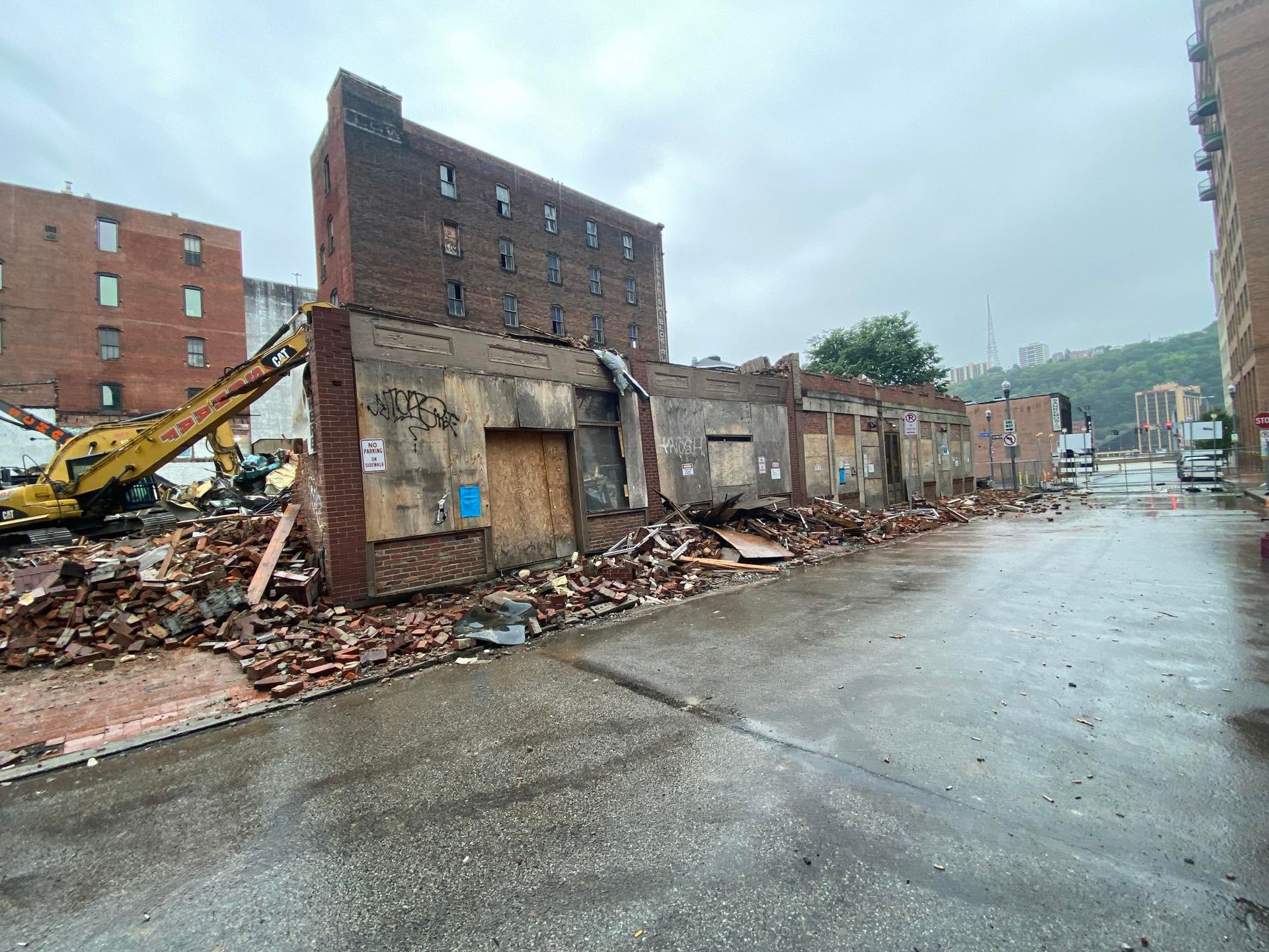 a row of abandoned buildings being demolished by Schaaf