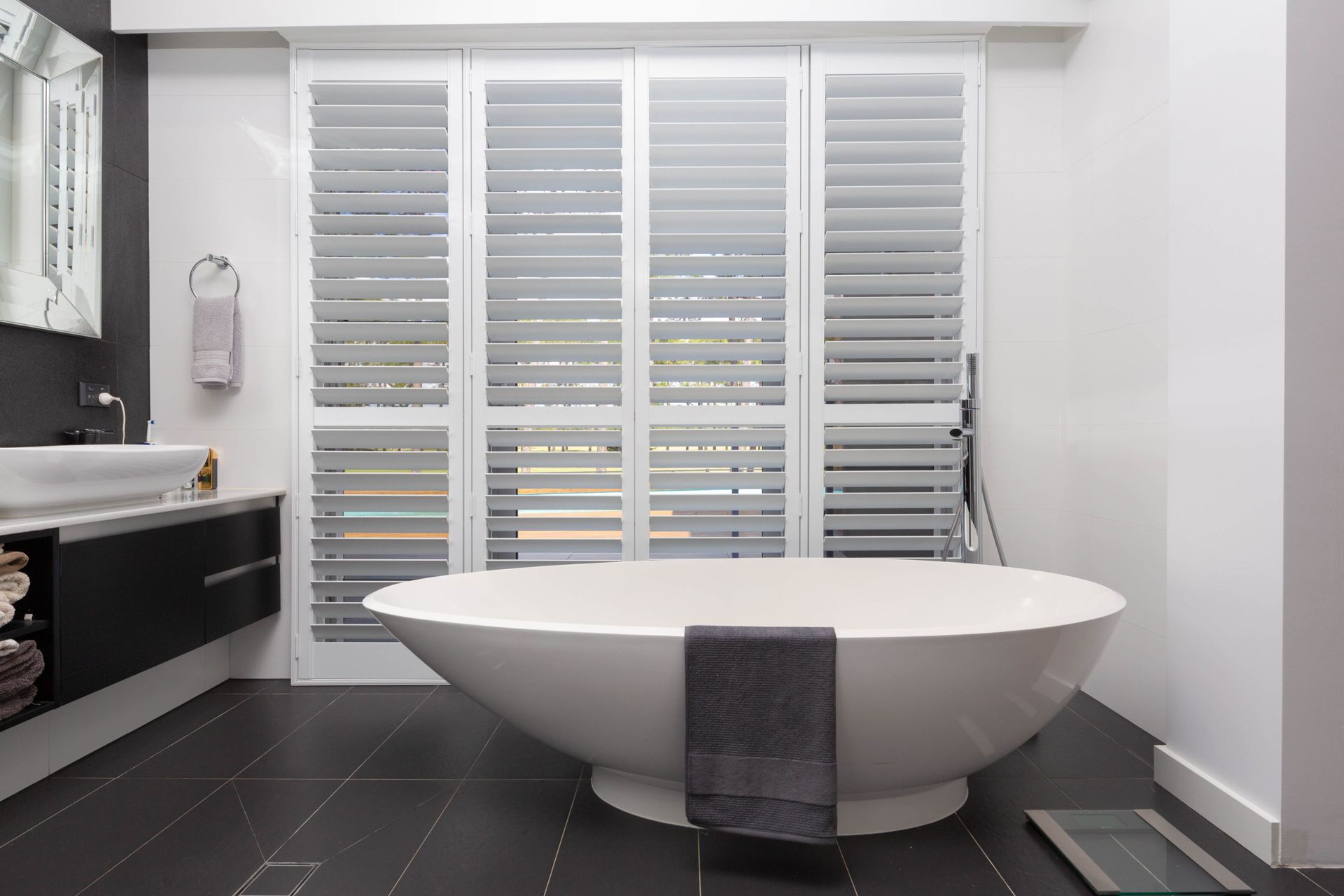 Rolling Shutters Brick House Windows Protection — Plantation Shutters in Mackay, QLD