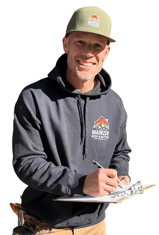 Smiling worker in gray hoodie and cap holding a clipboard against a white background