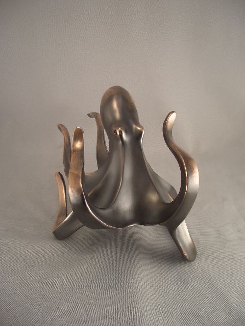 a statue of an octopus is sitting on a table