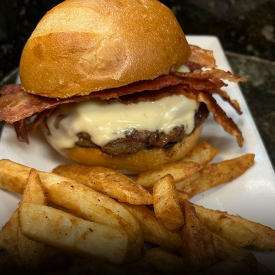 Cheeseburger with bacon and fries served at Edison Pizza in Edison NJ