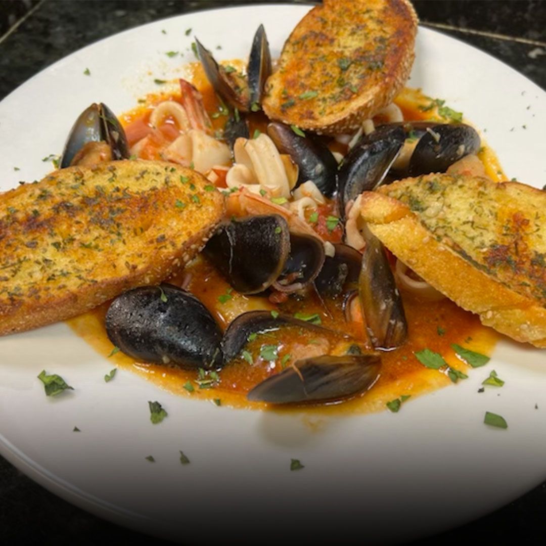 Seafood pasta with mussels and toasted bread at Edison Pizza in Edison NJ
