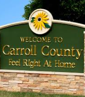 A green sign with gold text reads 