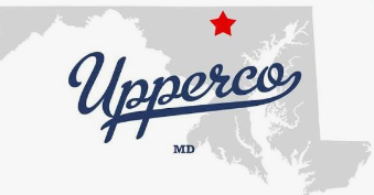 Upperco logo in blue script with a red star and gray Maryland silhouette background Upperco logo in blue script with a red star and gray Maryland silhouette background