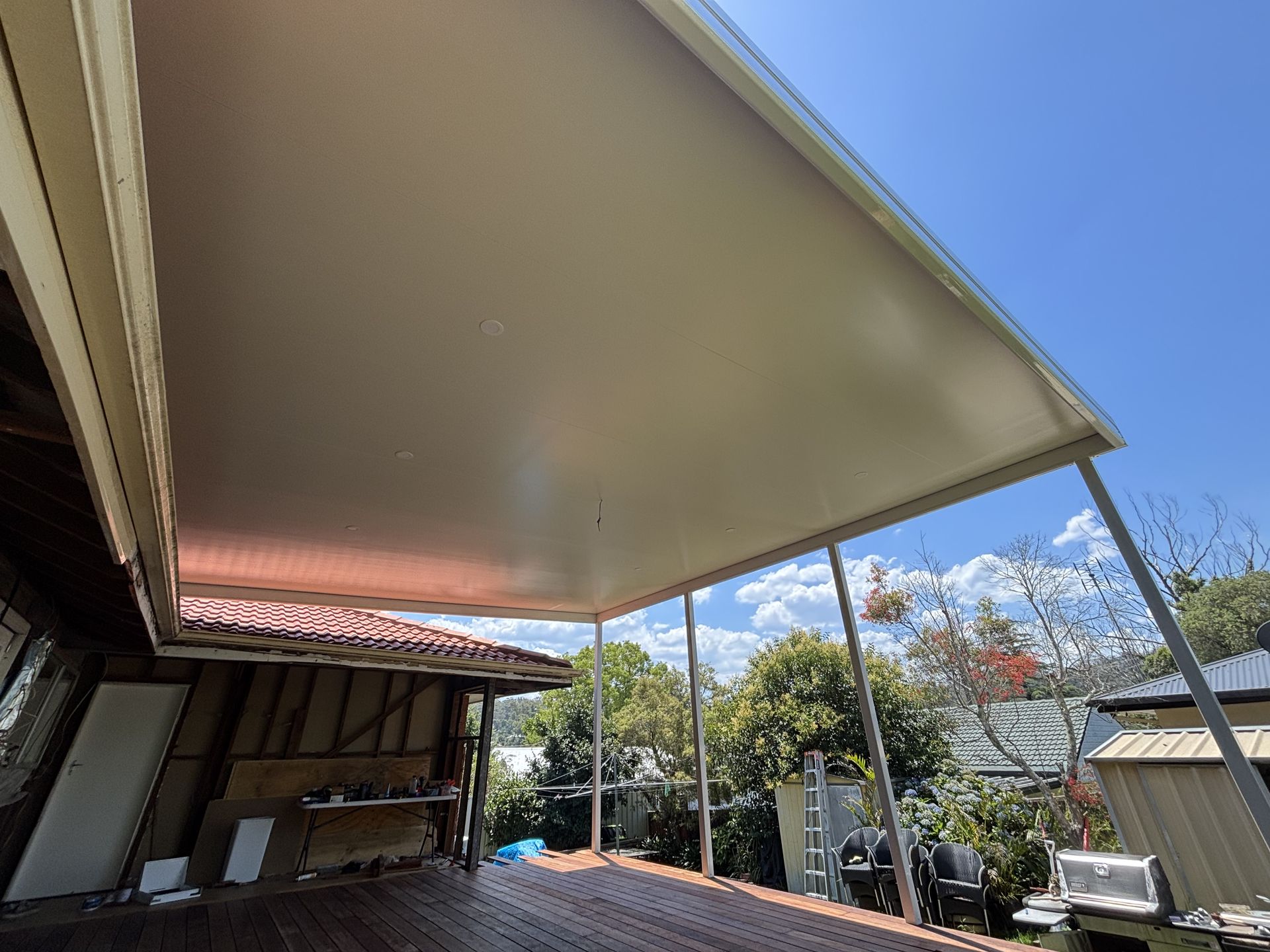 A White Roof Above a Garden Patio — Outdoor Leisure Living In Tuggerah, NSW