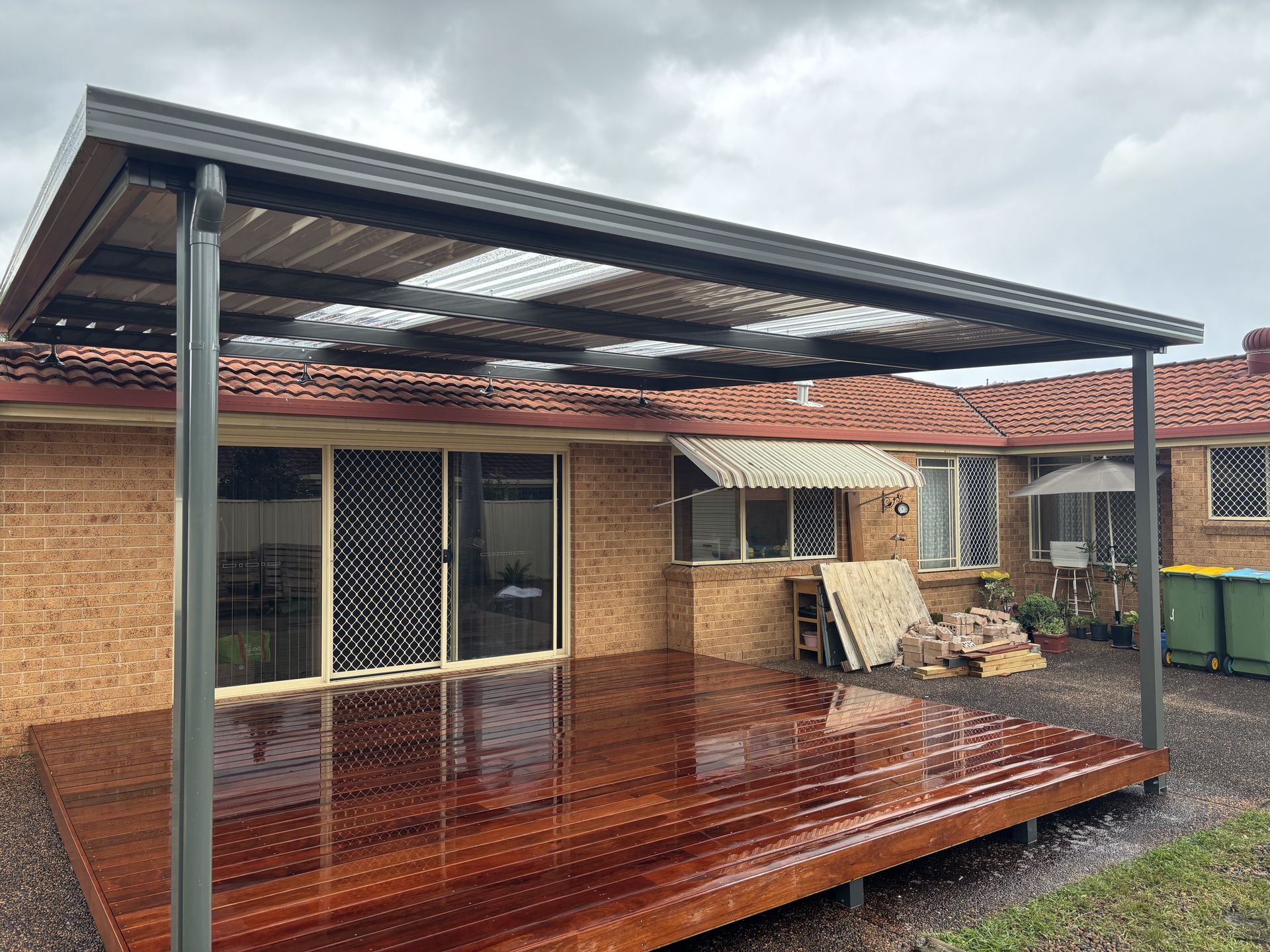 A Patio With a Gazebo and a Grill Next to a Swimming Pool — Outdoor Leisure Living In Wyong, NSW