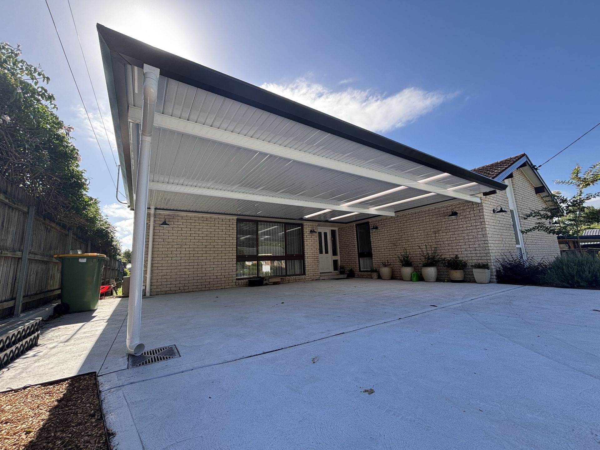 A Carport in a Parking Lot With Trees in the Background — Outdoor Leisure Living In Wyong, NSW
