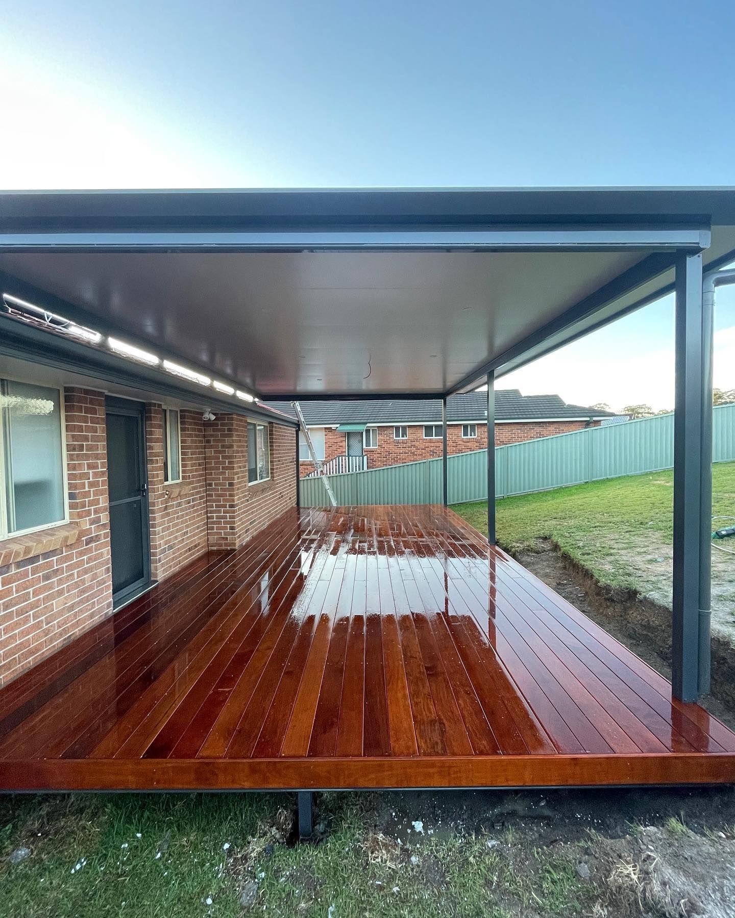 A Wooden Pavilion With a Bar and Stools in a Backyard — Outdoor Leisure Living In Gosford, NSW
