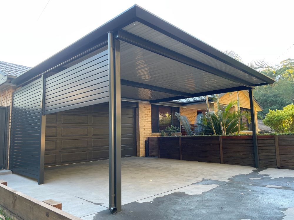 A carport is attached to the side of a house. — Outdoor Leisure Living In Bateau Bay, NSW