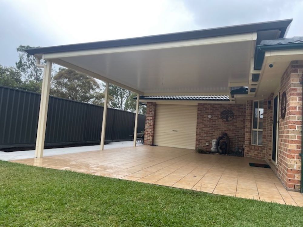 A House With a Carport and a Fence in the Backyard — Outdoor Leisure Living In Lake Macquarie, NSW
