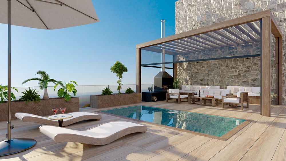 A Rooftop Patio With a Swimming Pool and a Pergola — Outdoor Leisure Living In Lake Macquarie, NSW