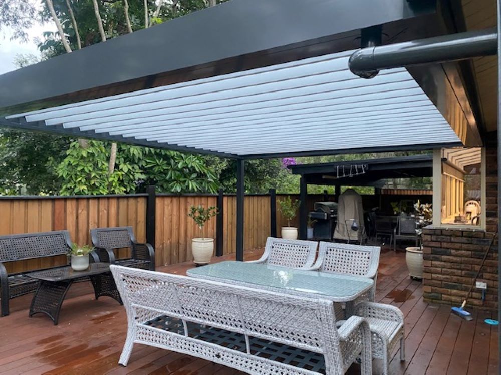 A Patio With a Table and Chairs Under a Canopy — Outdoor Leisure Living In Woy Woy, NSW