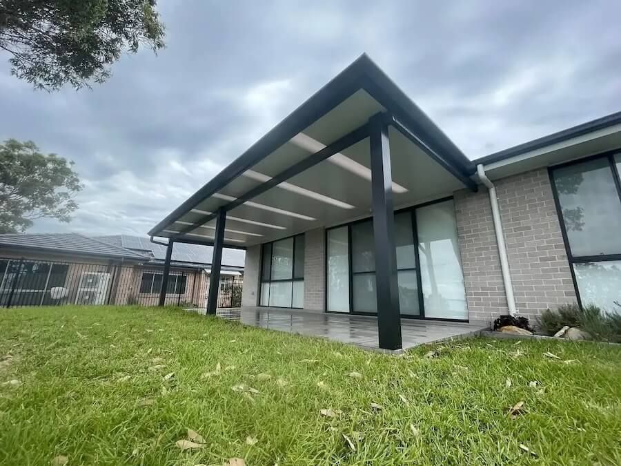 A house with a covered patio in front of it — Outdoor Leisure Living In Tuggerah, NSW