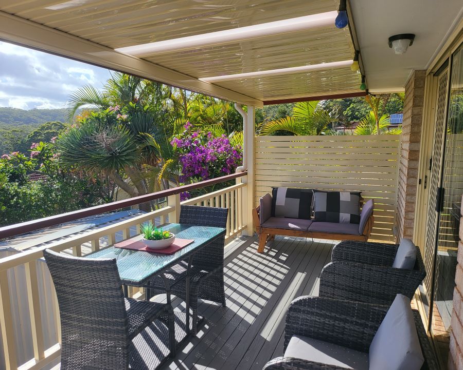 A Balcony With a Table, Chairs, and a Couch — Outdoor Leisure Living In Lake Macquarie, NSW