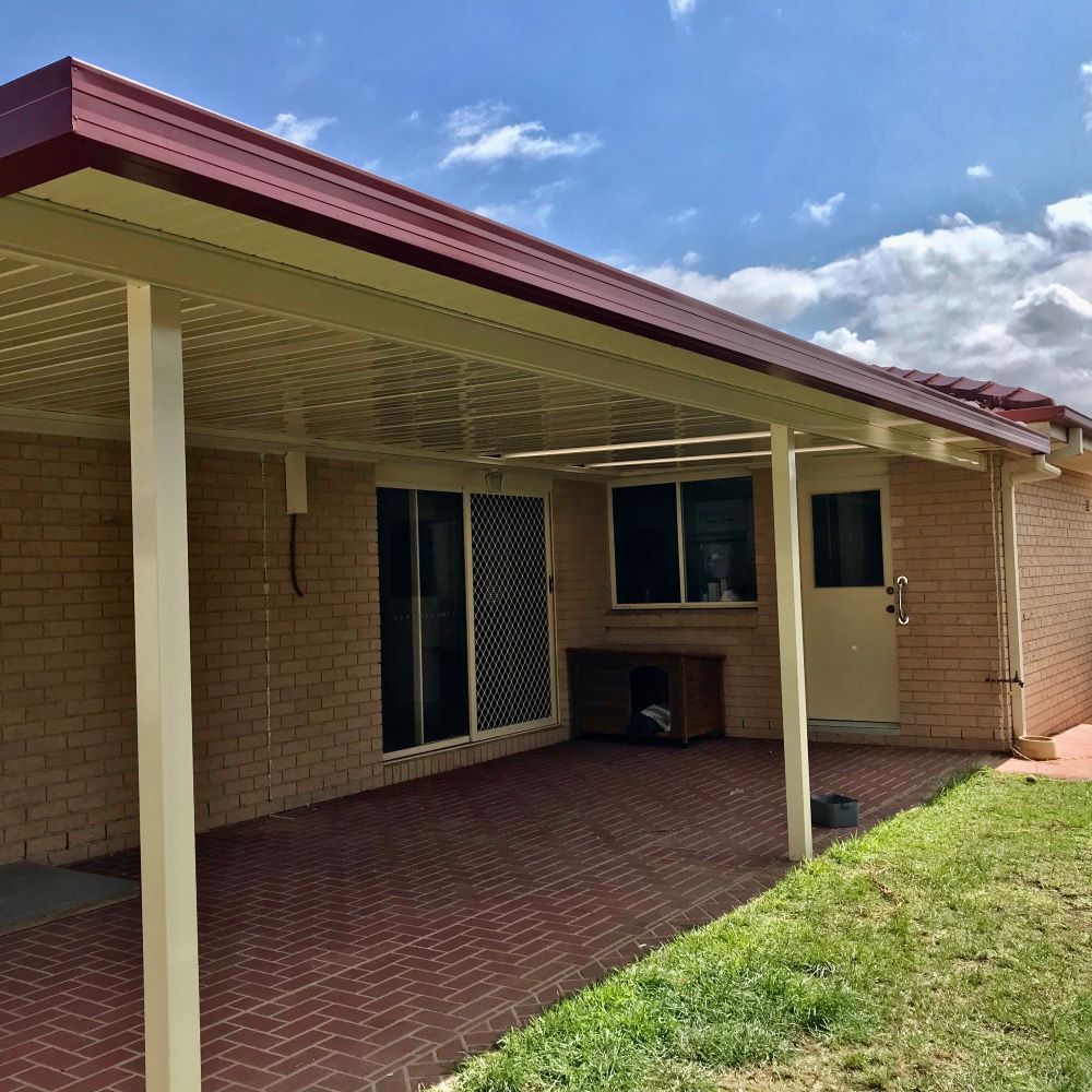 A Brick House With a Covered Patio in Front of It In Tuggerah