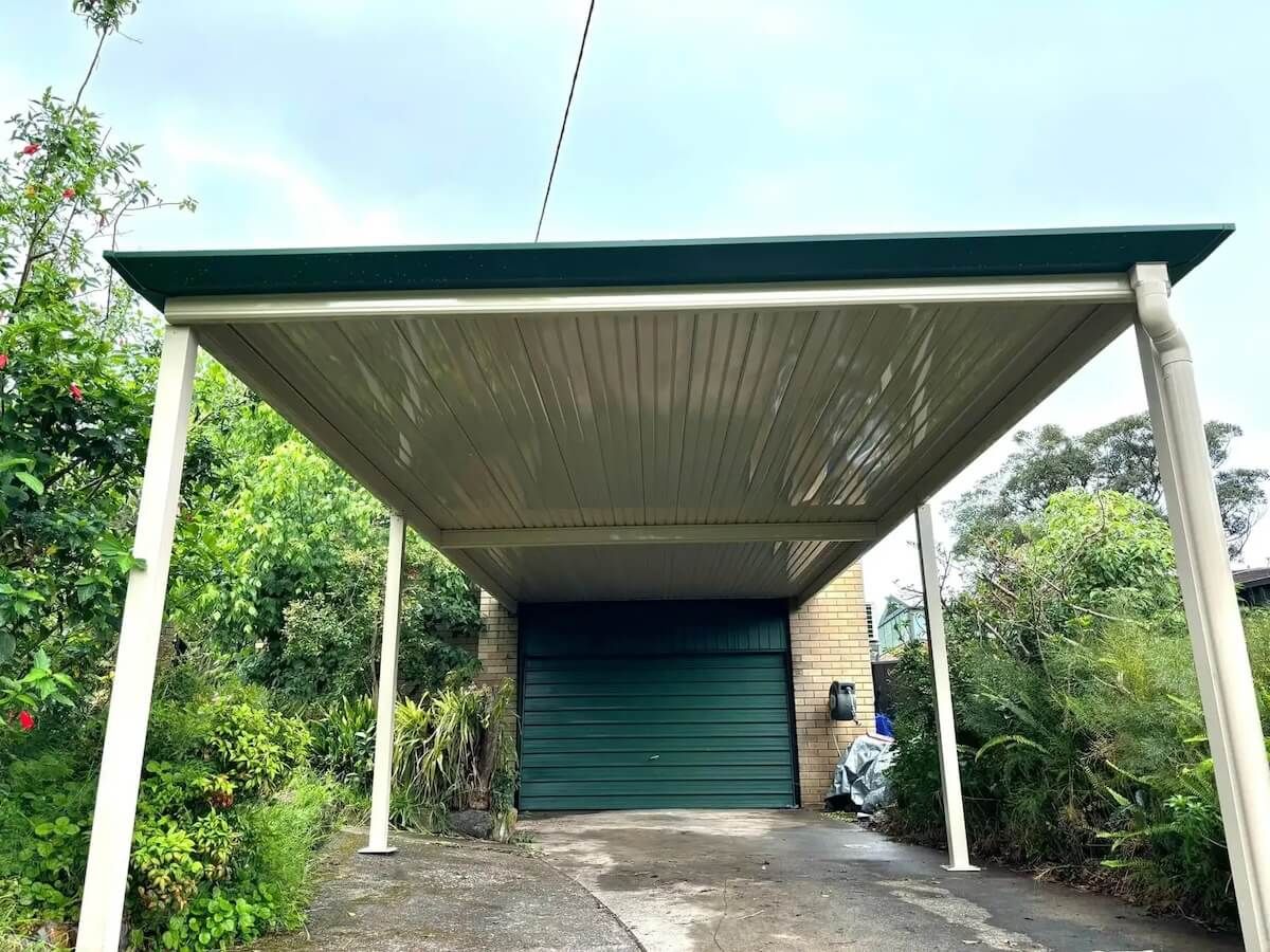 A Carport is Attached to a Garage With a Green Door In Centeral Coast