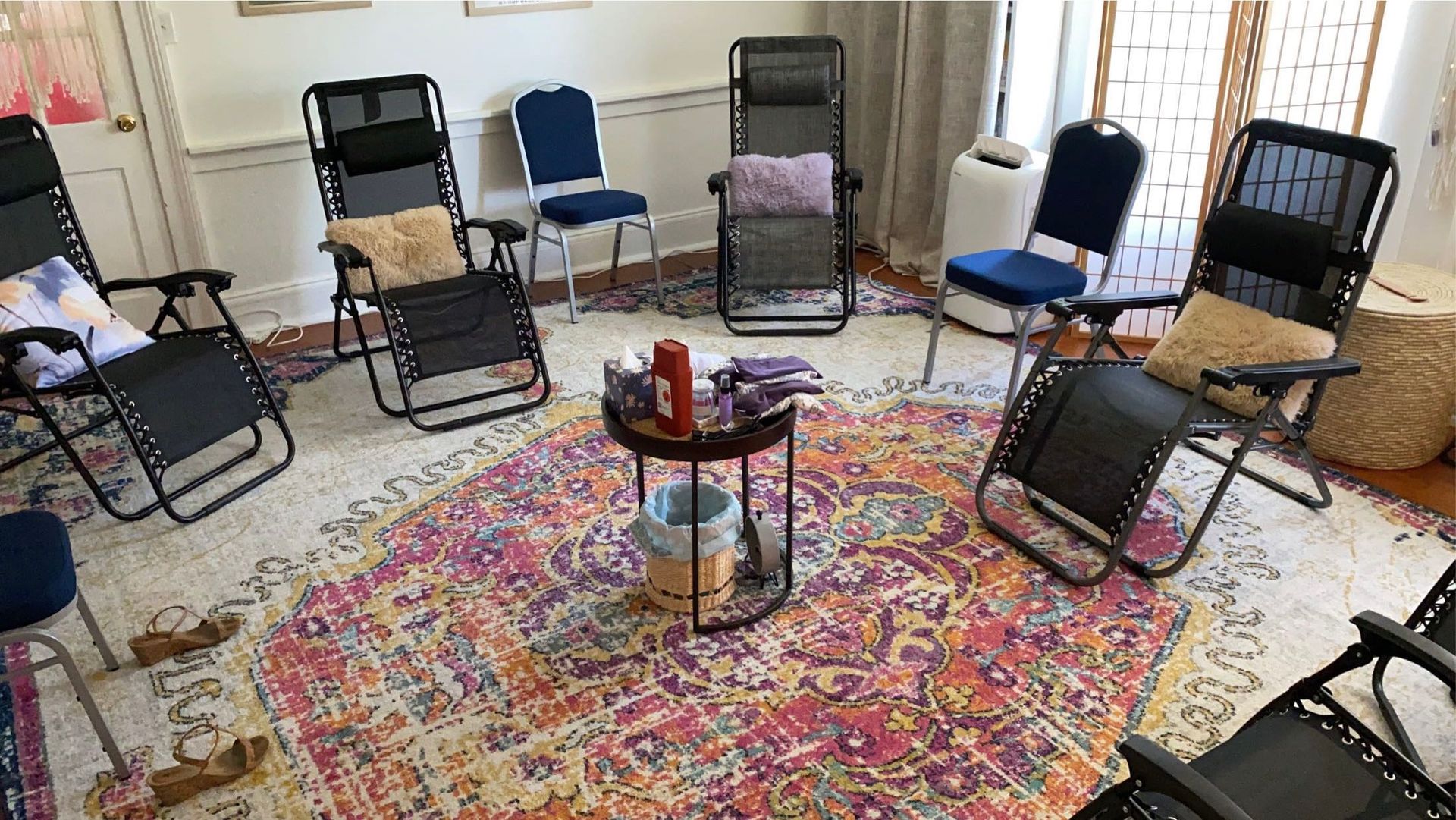 A room filled with folding chairs and a table.