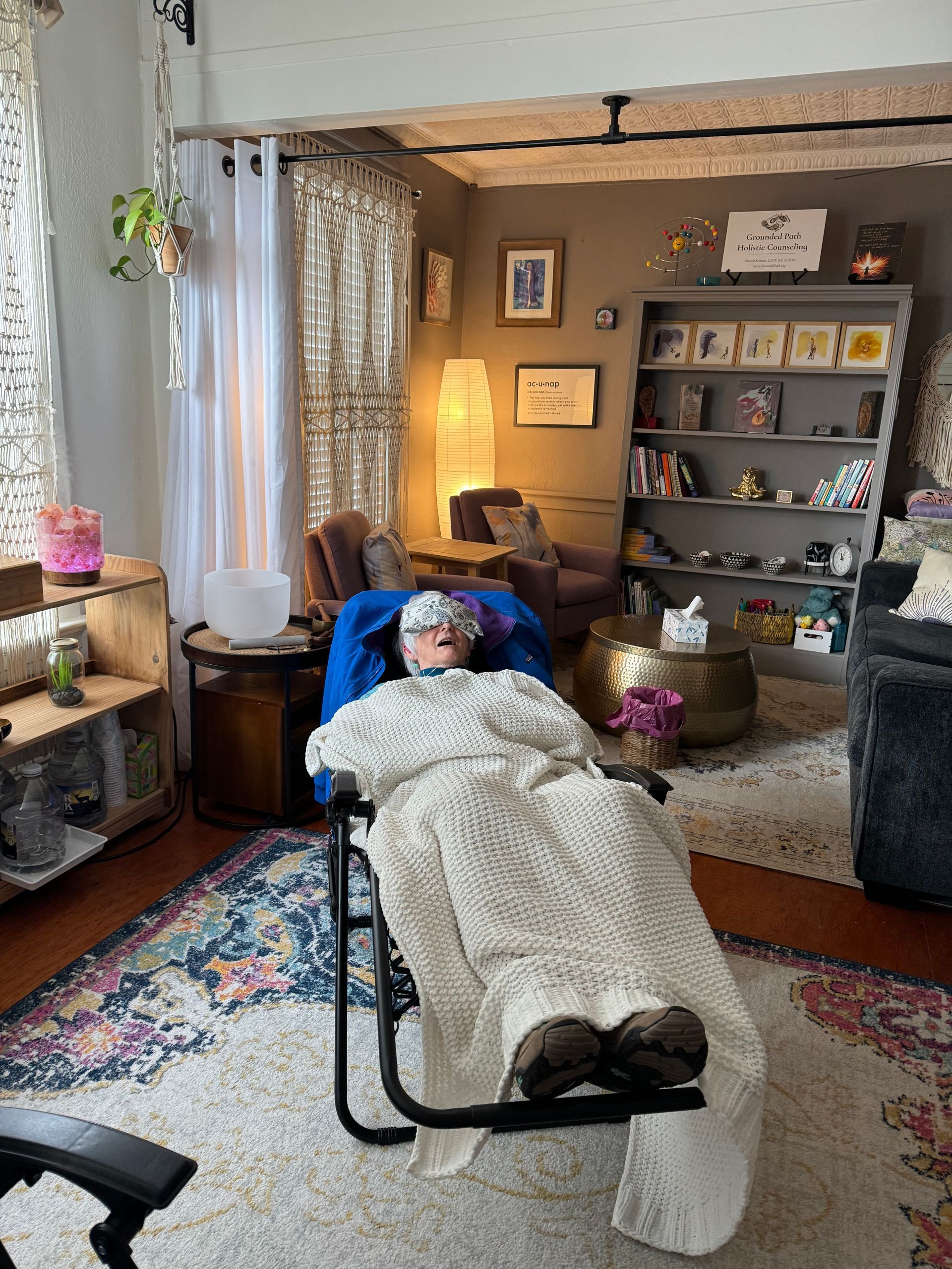 A client is laying in a zero gravity chair in our office