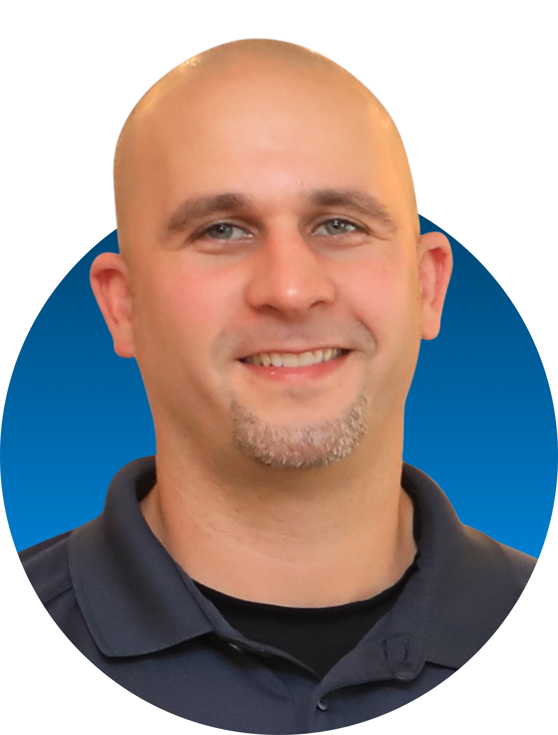 Bald man with goatee smiles, blue circle background, wearing a dark gray polo.