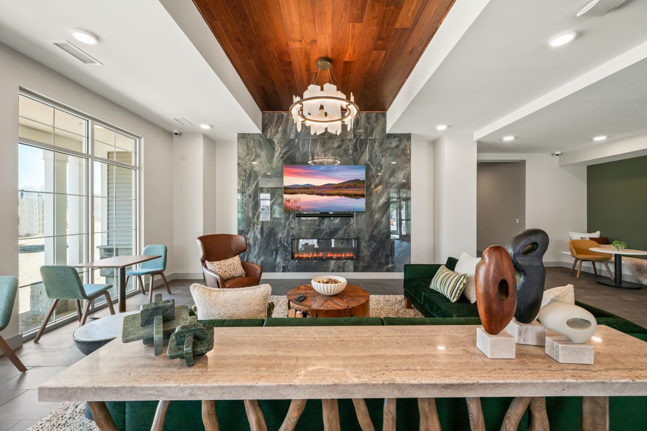 Rendering of residents relaxing in one of the luxurious indoor common areas at Riverline Conway.