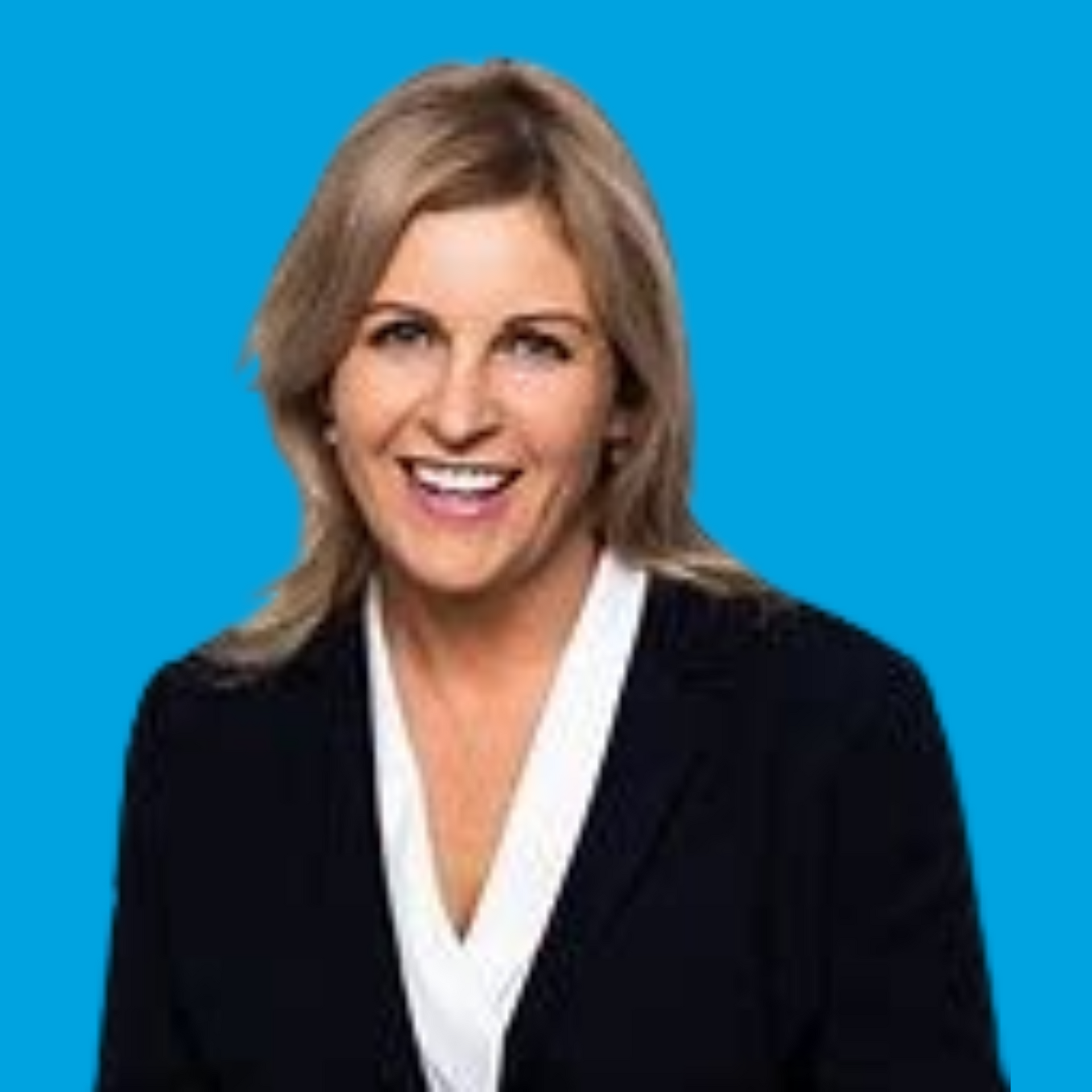 Smiling woman in a black blazer with a white blouse against a blue background