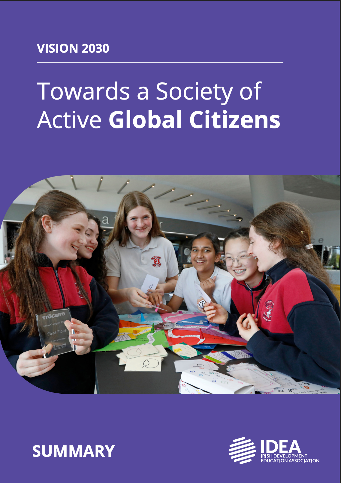 Cover of a report titled “Towards a Society of Active Global Citizens,” showing students around a table with cards.