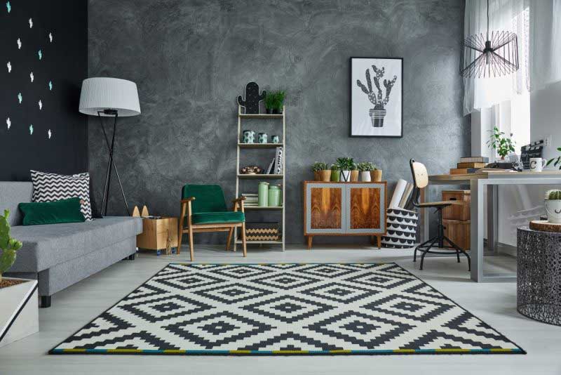 There is a rug in the middle of the living room.