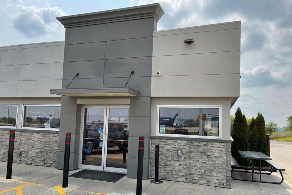 Use a variety of natural stone and brick finishes for retail store buildings.