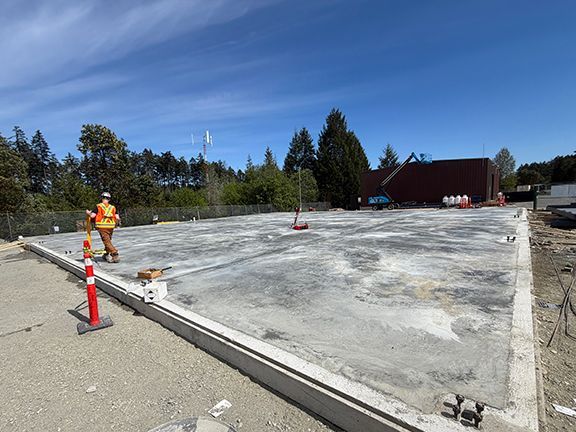 Concrete foundation pad installed at VMAC construction site in BC