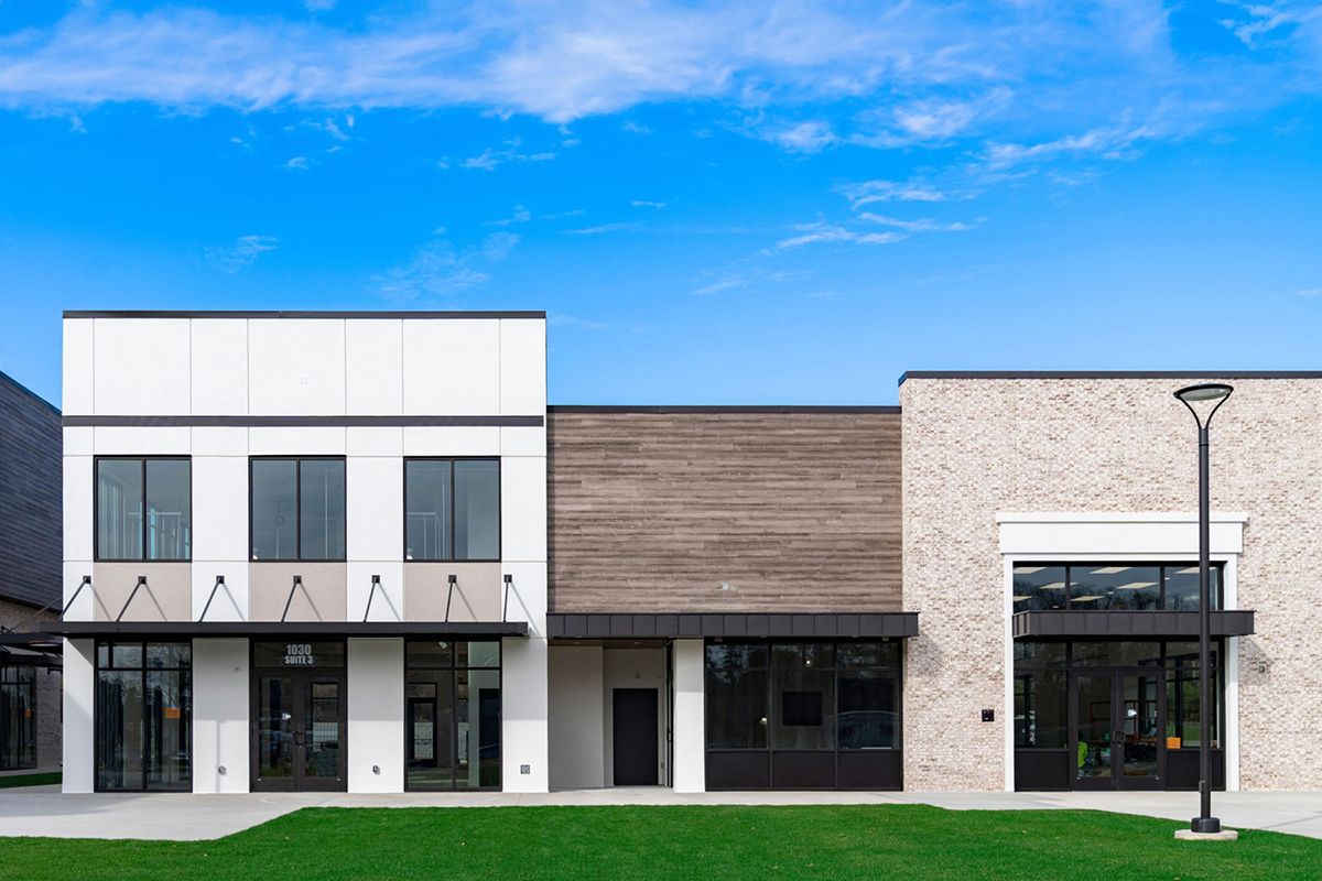 Use a combination of natural stone and wood with your commercial steel building design.