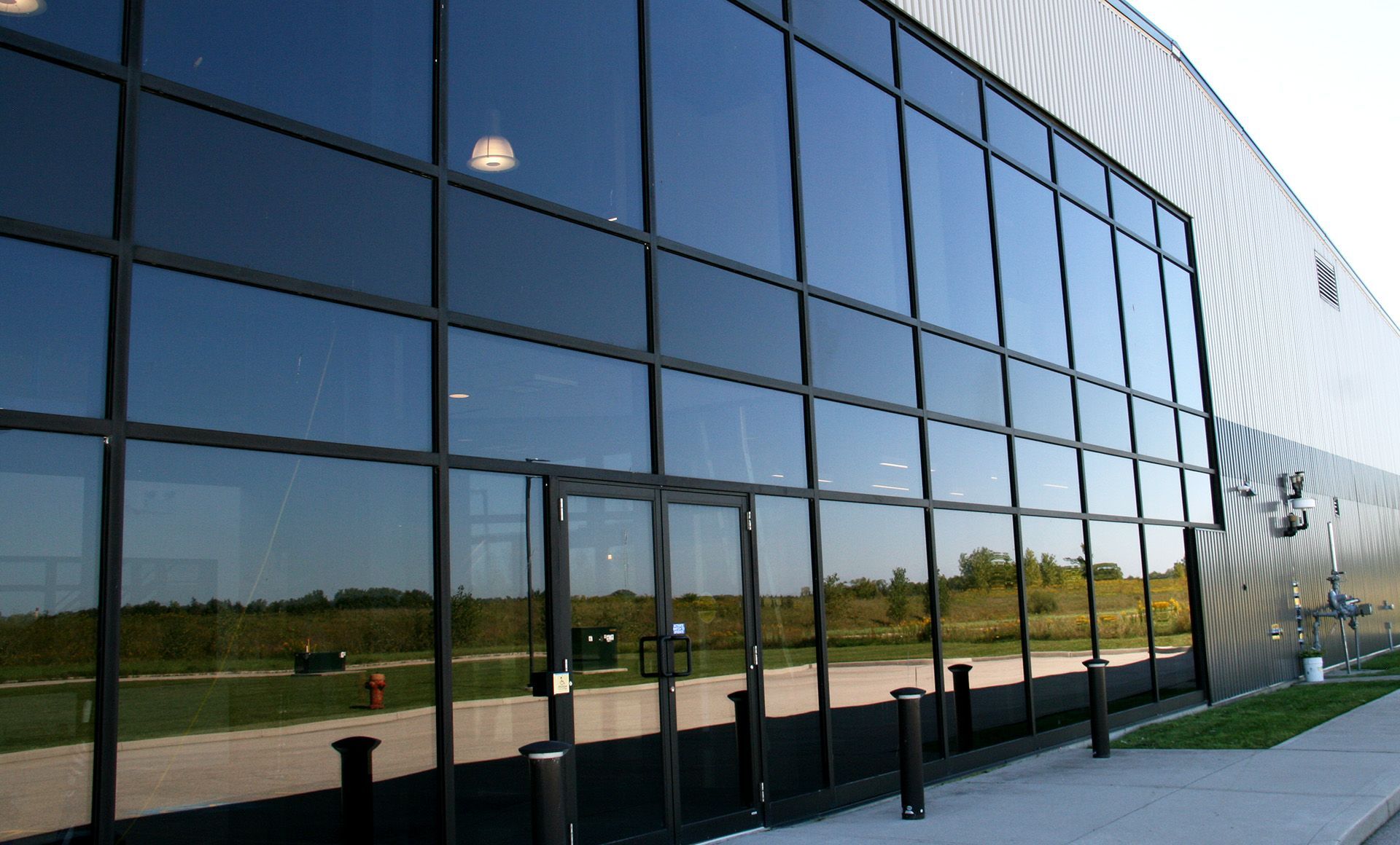 Expansive walls of window glass are transforming how Canadians experience their built environment.