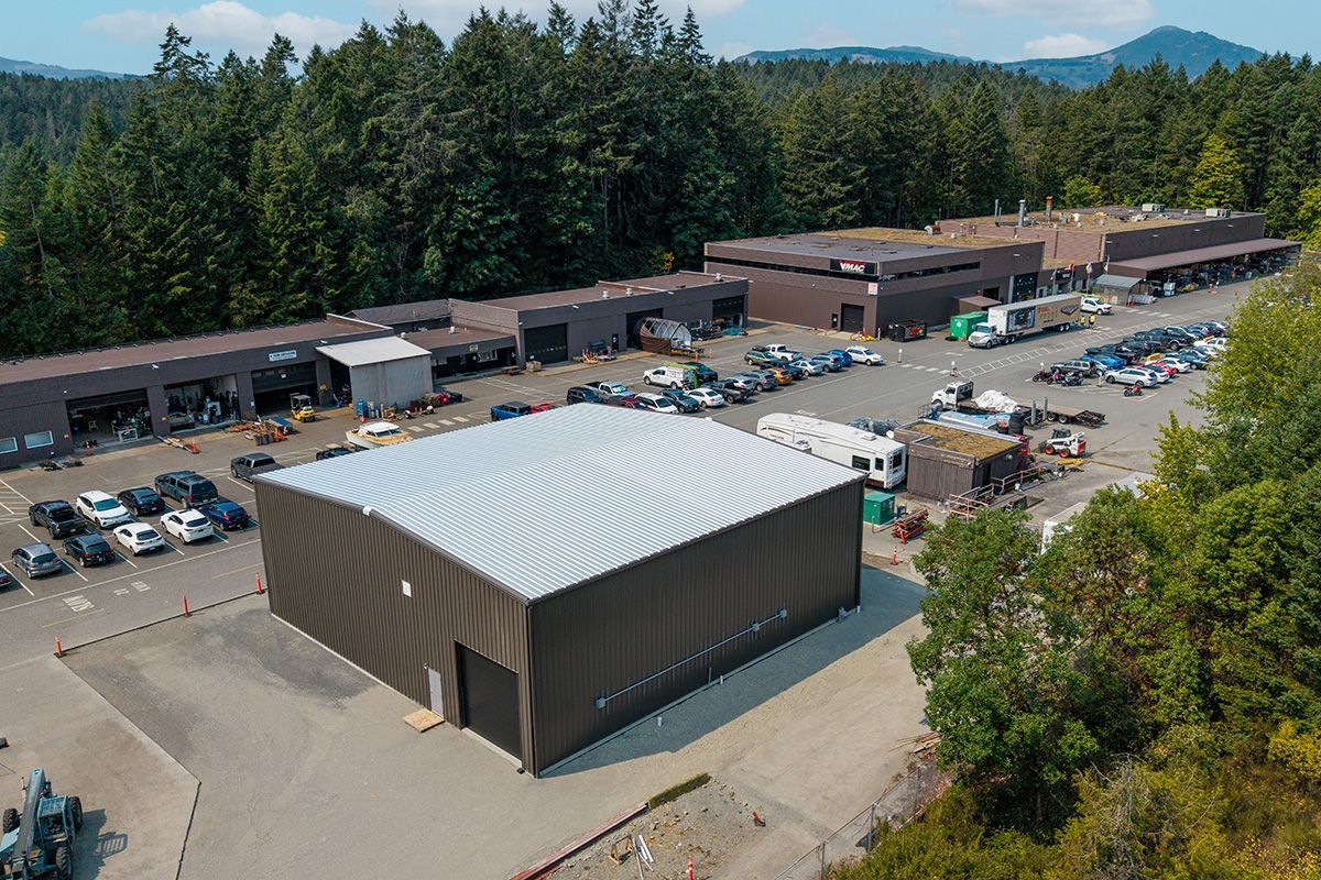 Brown pre-engineered steel building finished for VMAC in British Columbia