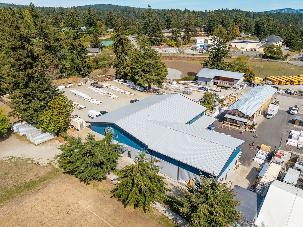 Metal building complex made up of two structures connected by mezzanine