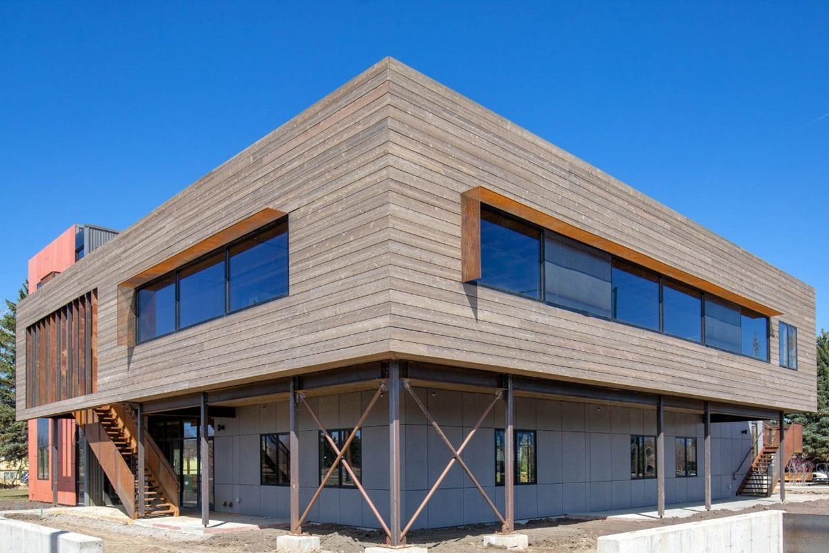 Pre-engineered steel buildings can be accented with wood and timber to create a natural, modern look.