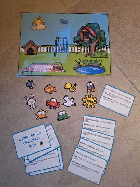 Een kleurrijke afbeelding met uitgeknipte dieren en kaartjes voor een educatief spel voor kinderen.