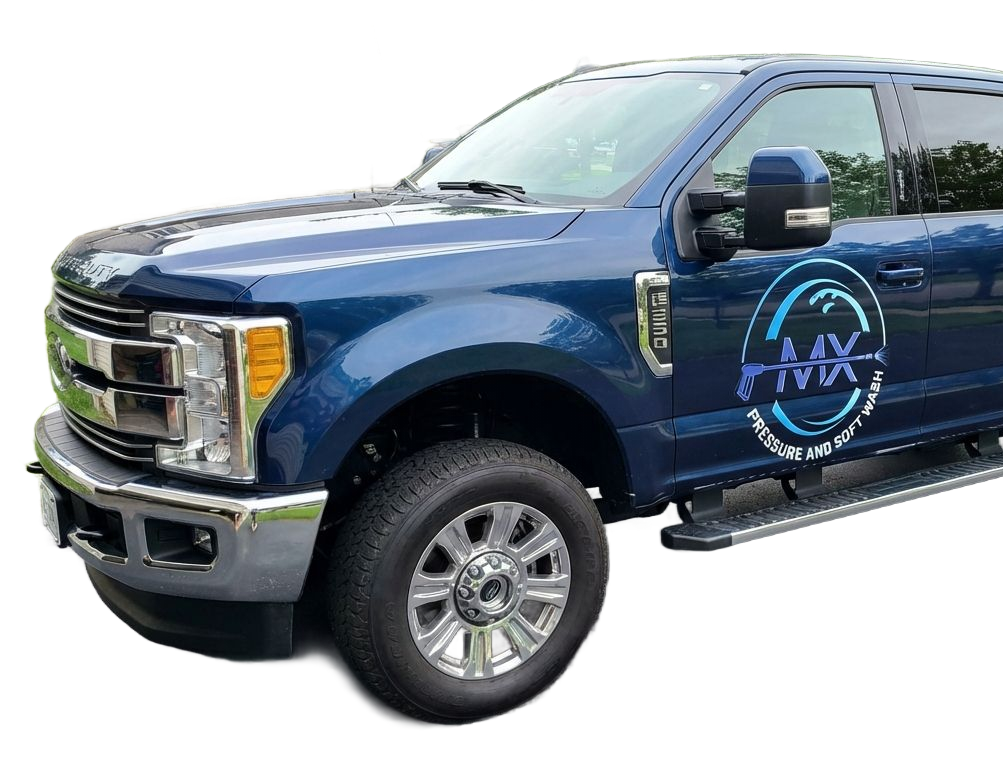 Blue pickup truck with company logo on the side. Chrome accents and running boards.
