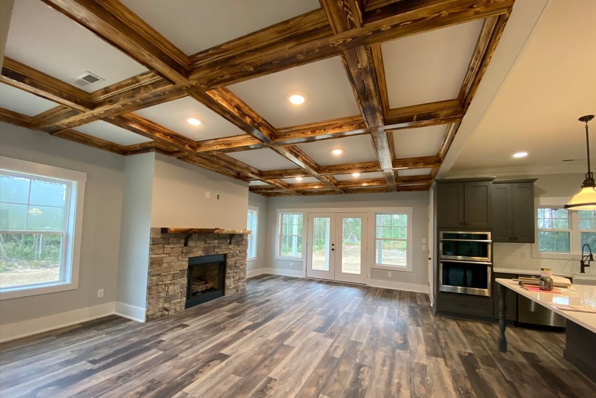 Living Room With Coffered Ceiling And Fireplace