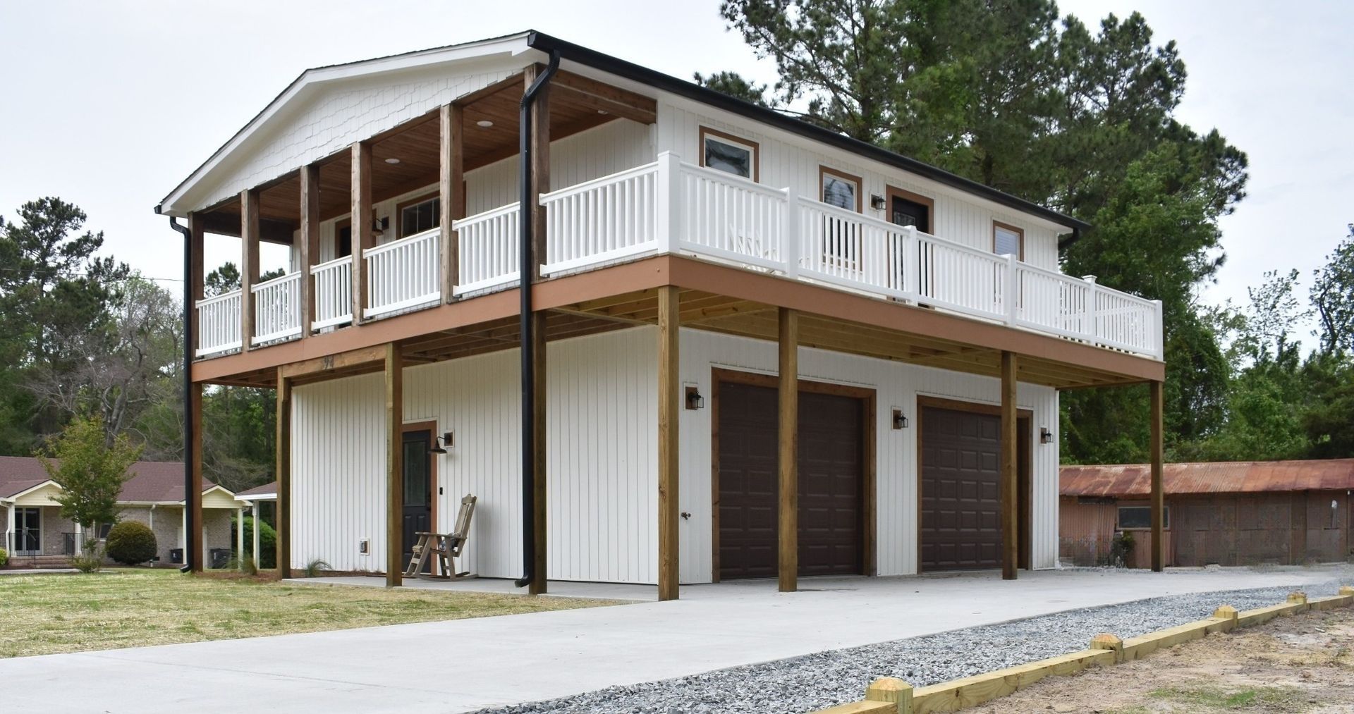 Two-Story House With Garage And Porch