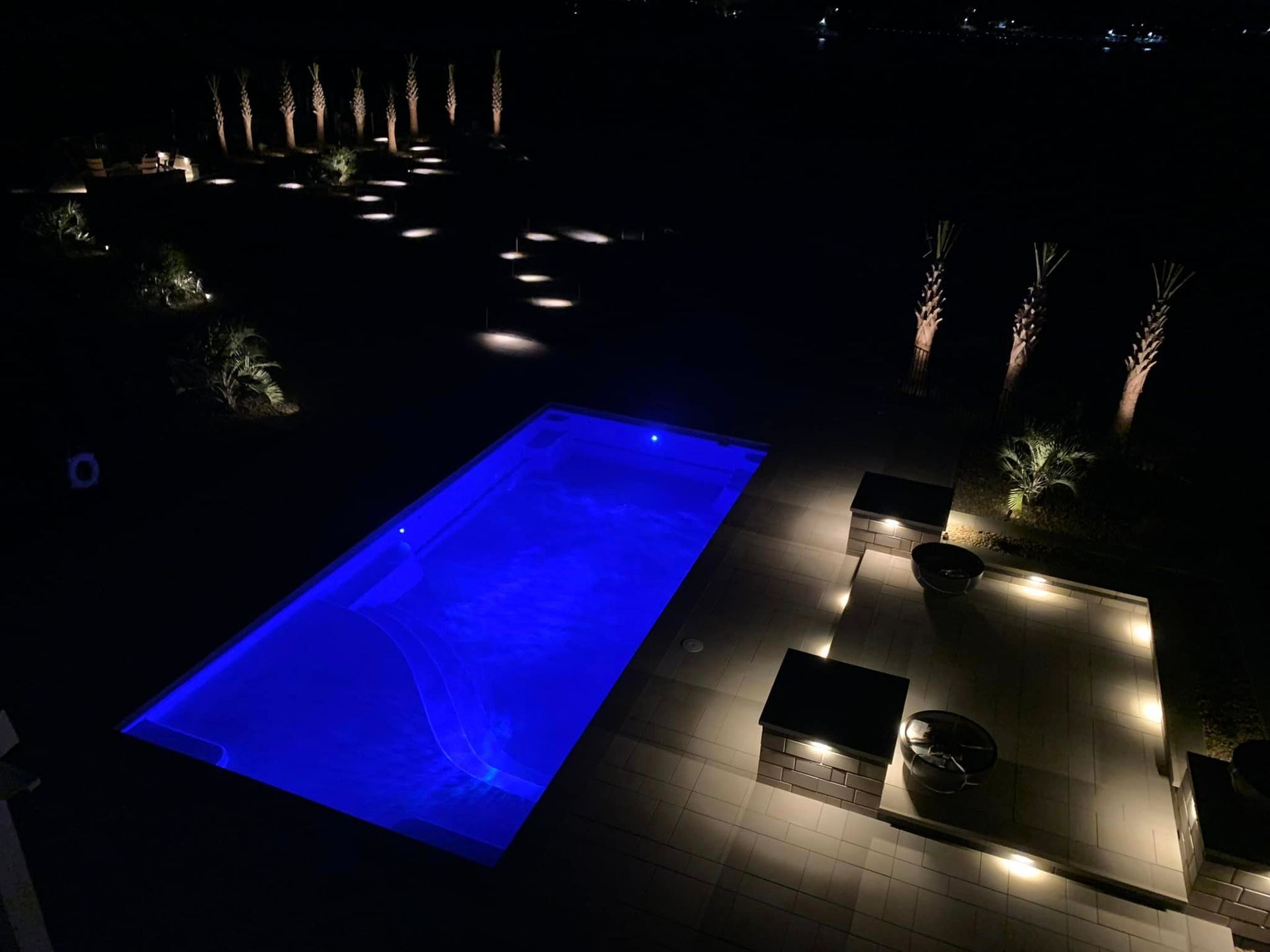 Night View Of Pool With Landscape Lighting