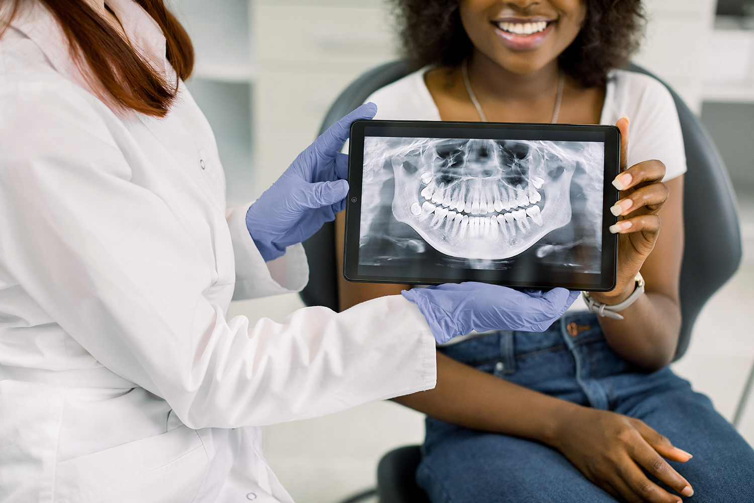 dentist holding a digital imaging scan