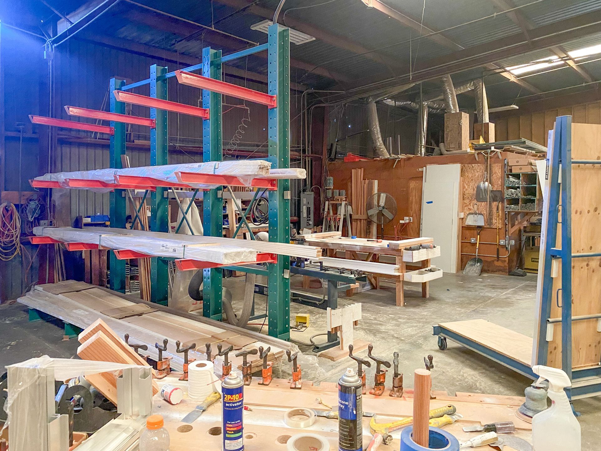 A warehouse filled with lots of wood and tools.