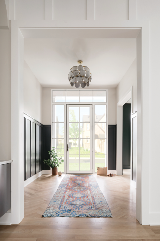 A close up of a white cabinet with a crown molding.