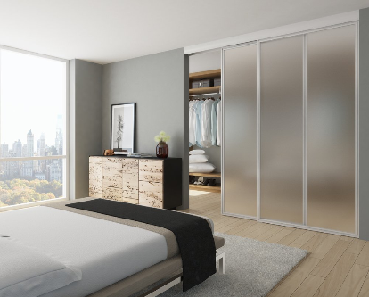 A bedroom with a large bed and a flat screen tv